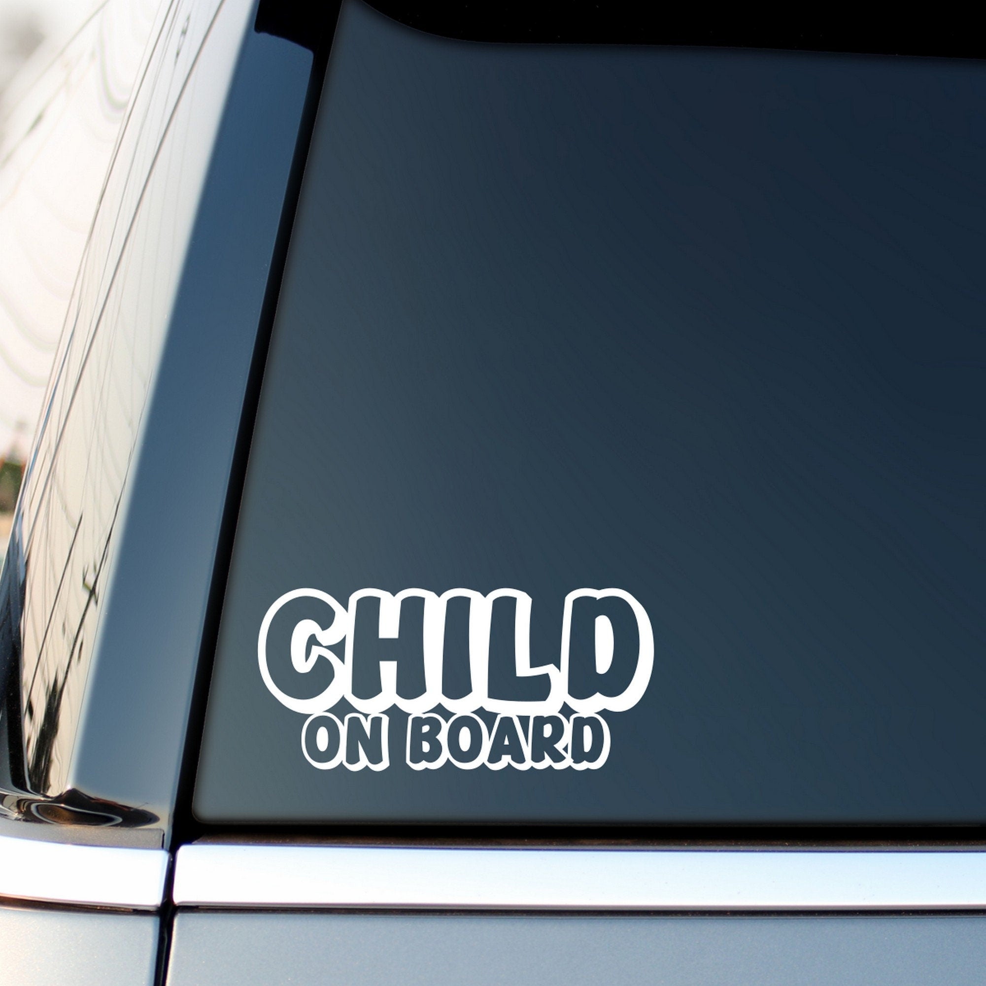 Child On Board outline car sticker shown on a vehicle rear window