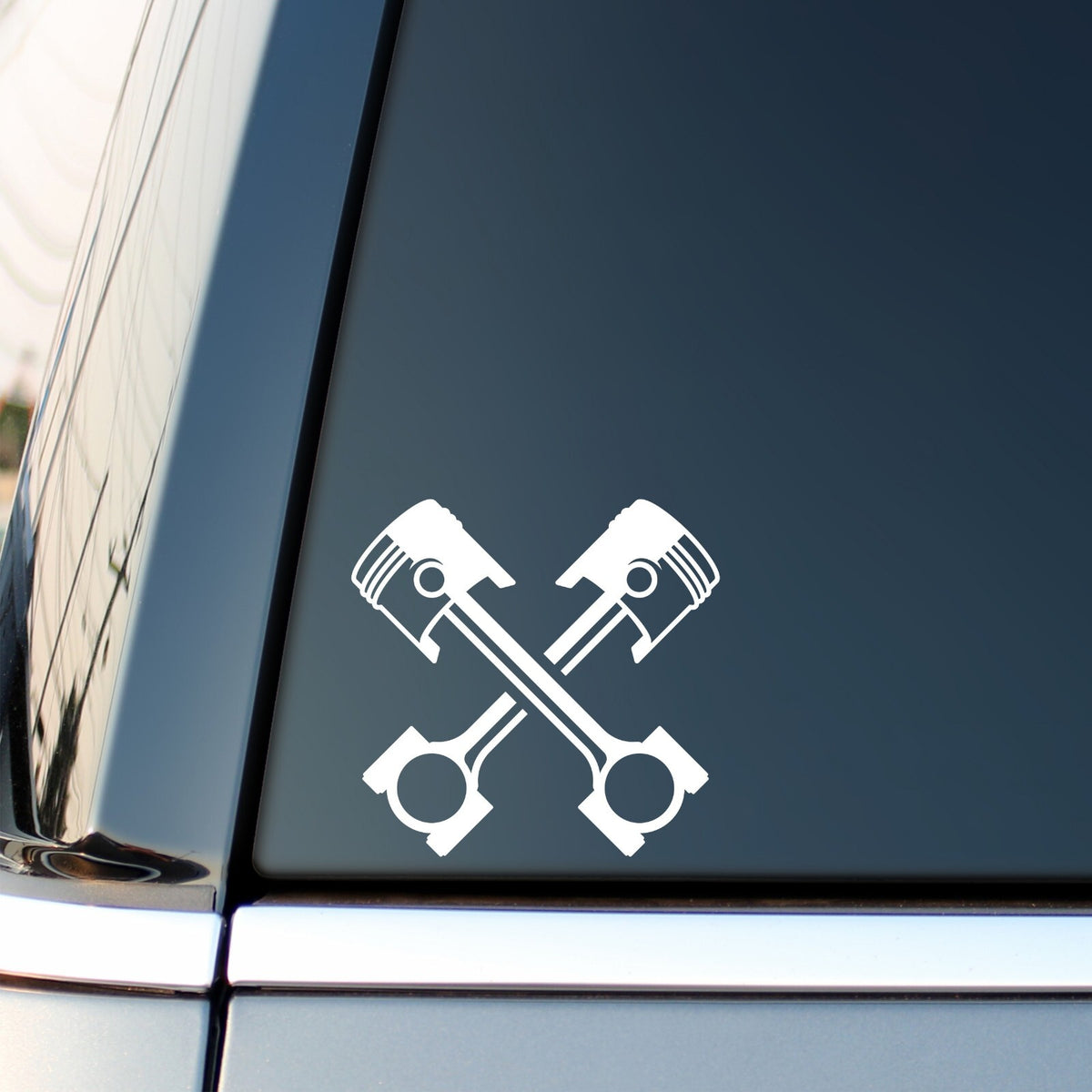 Crossed Pistons vinyl decal for car, van or camper.