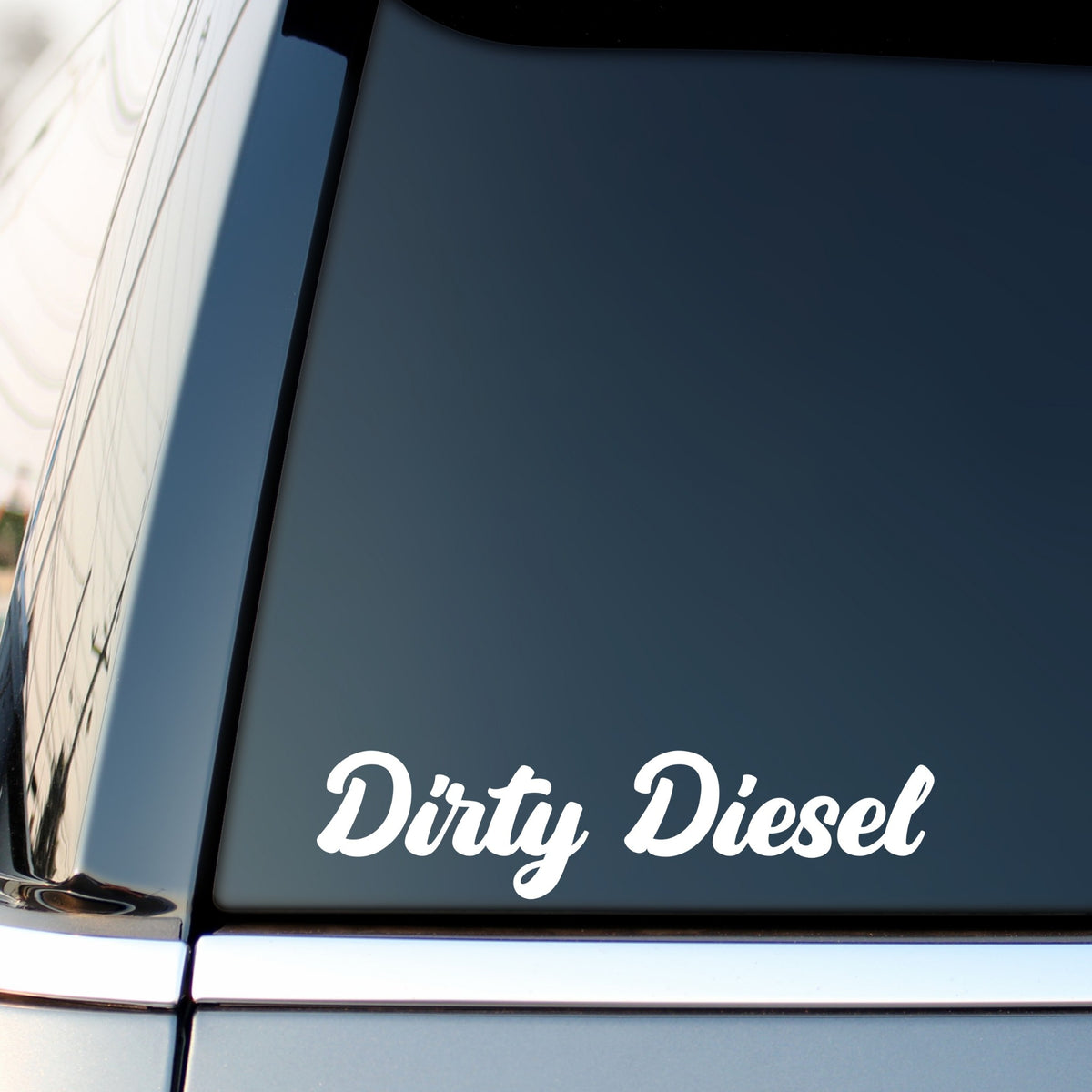 White Dirty Diesel bold script car sticker on a dark vehicle side window.