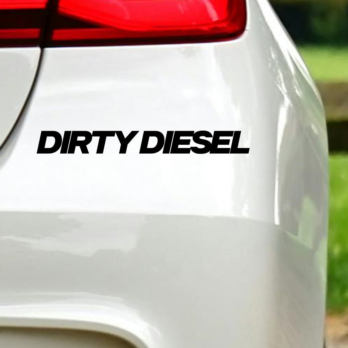 Black Dirty Diesel slanted block lettering decal on white vehicle bodywork.