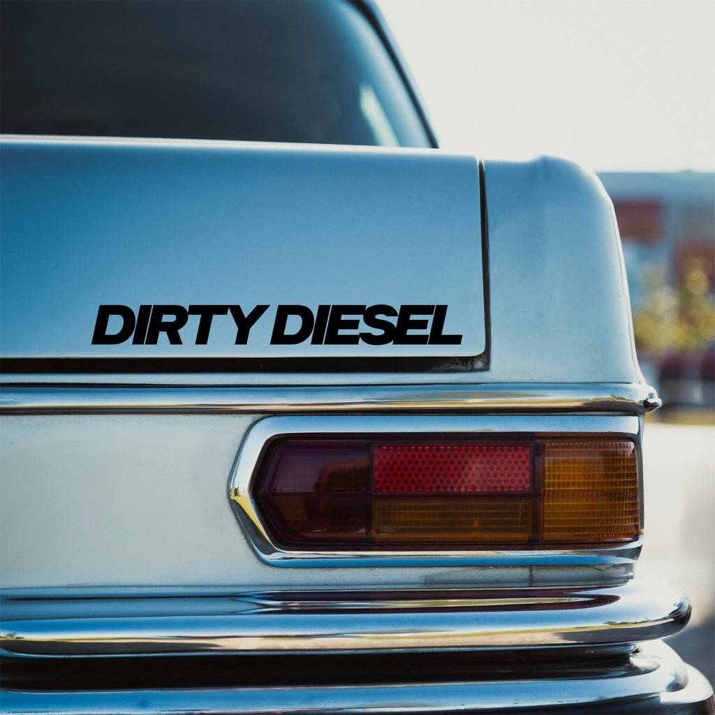 Black Dirty Diesel slanted block car sticker on the rear panel of a pale blue classic car.