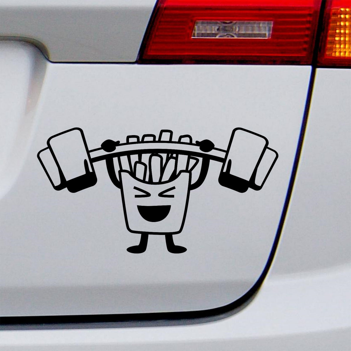 Black french fries barbell decal on a white vehicle tailgate.