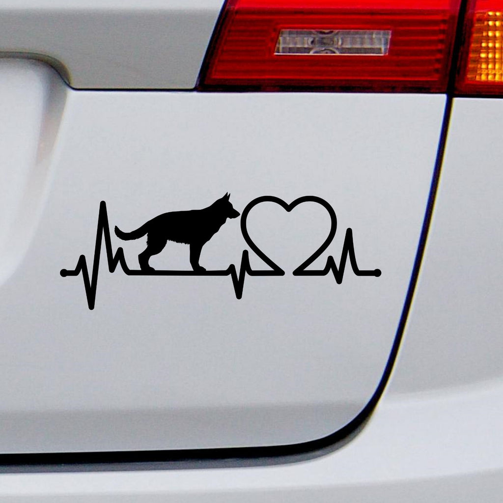 Black german shepherd heartbeat decal on a white vehicle tailgate.