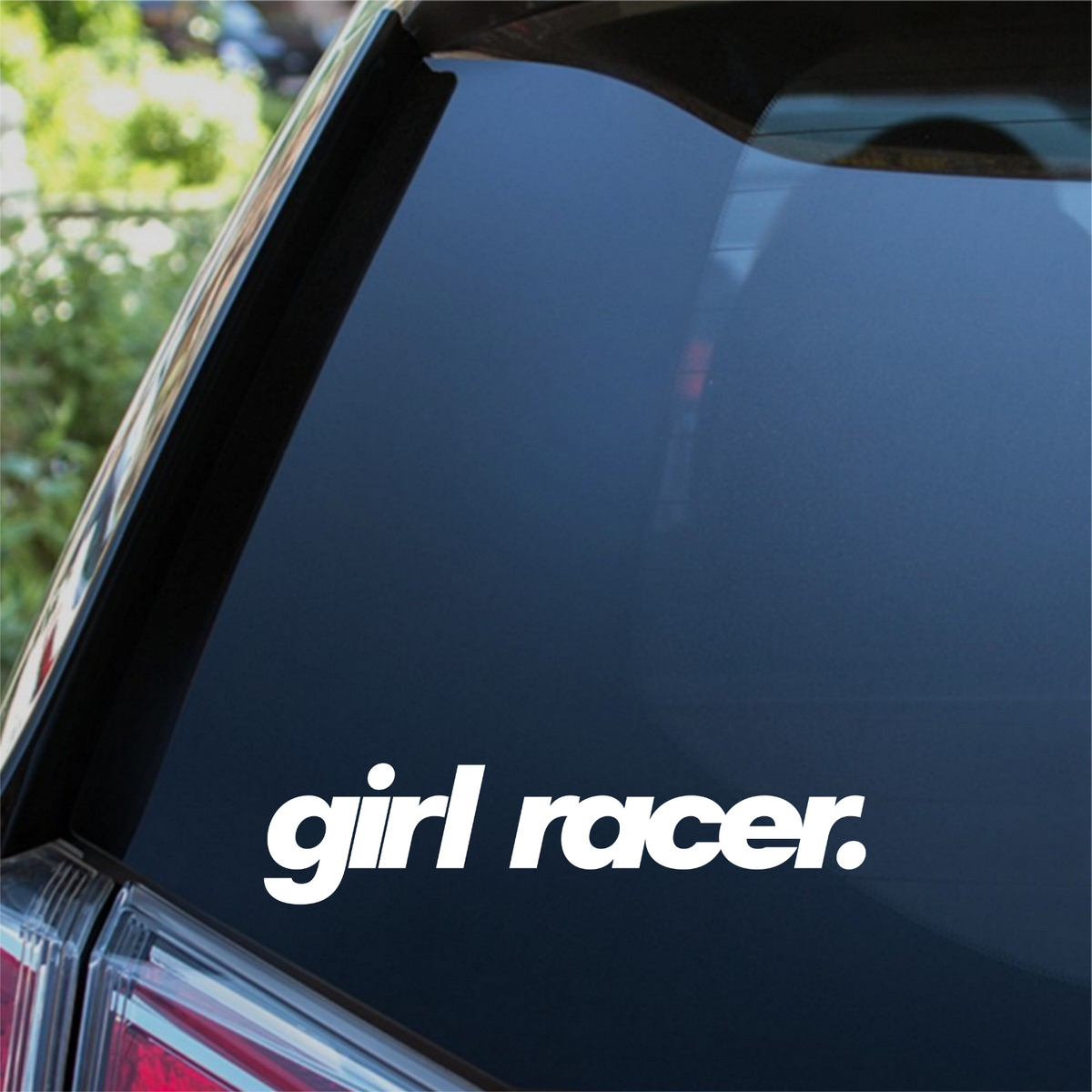 White Girl Racer bold italic decal on a car rear window.
