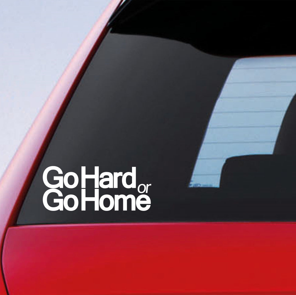 White Go Hard Or Go Home stacked lettering sticker on a red car window.