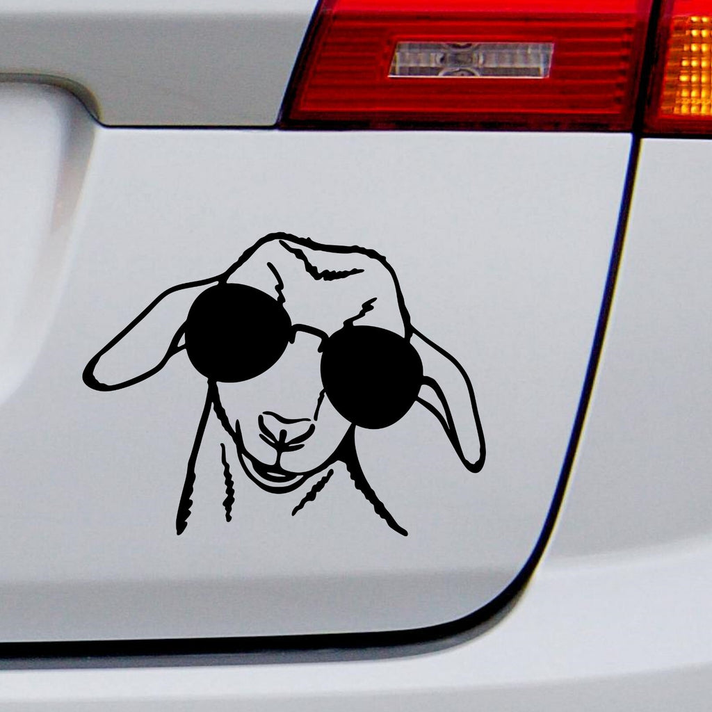 Black goat with sunglasses decal on a white vehicle tailgate.
