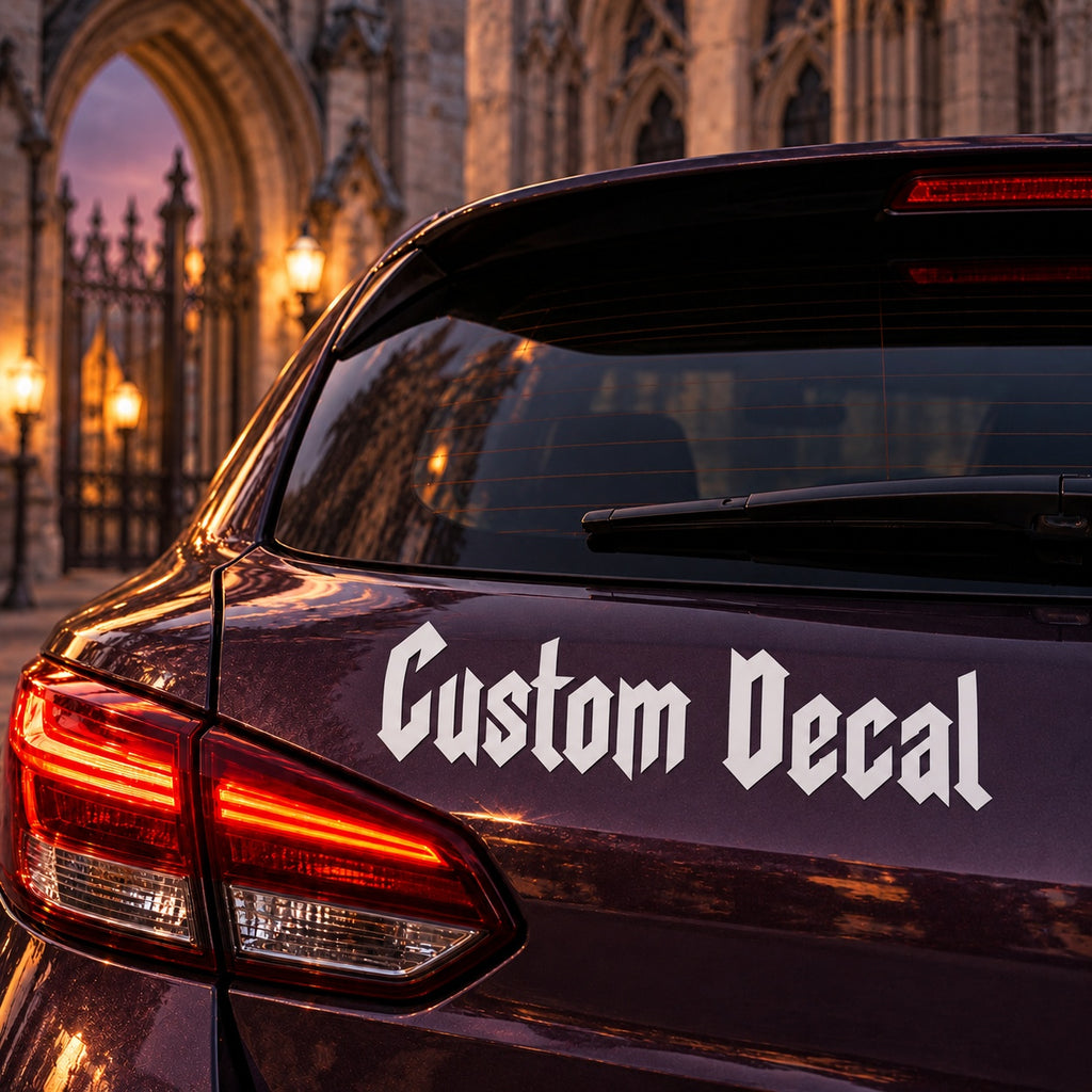 White Custom Decal Gothic lettering applied to the rear bodywork of a plum hatchback.