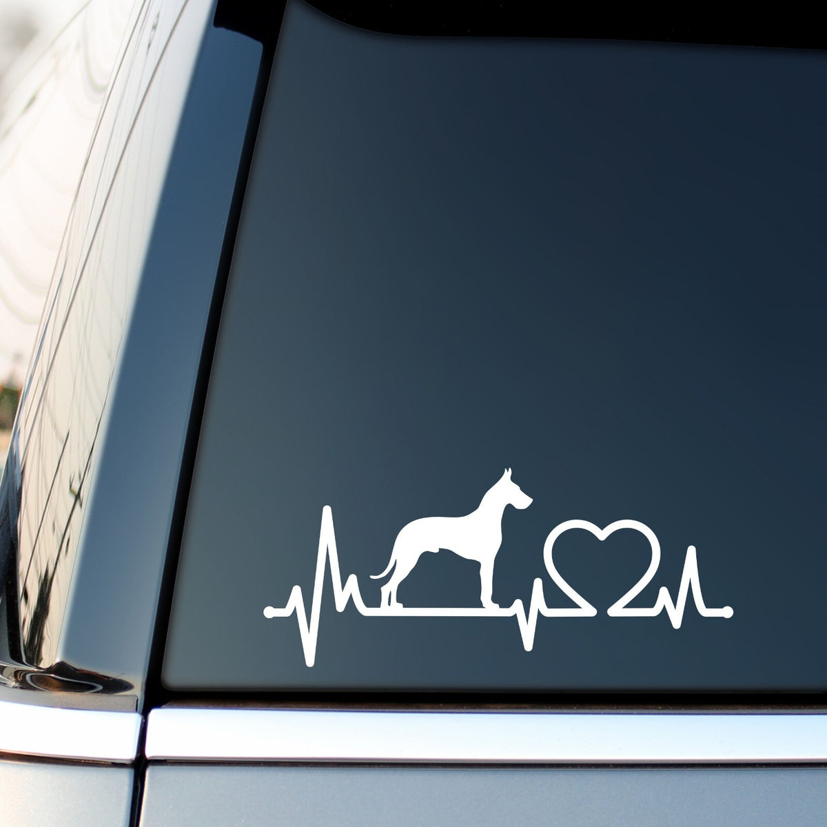 White great dane heartbeat sticker on a vehicle side window.