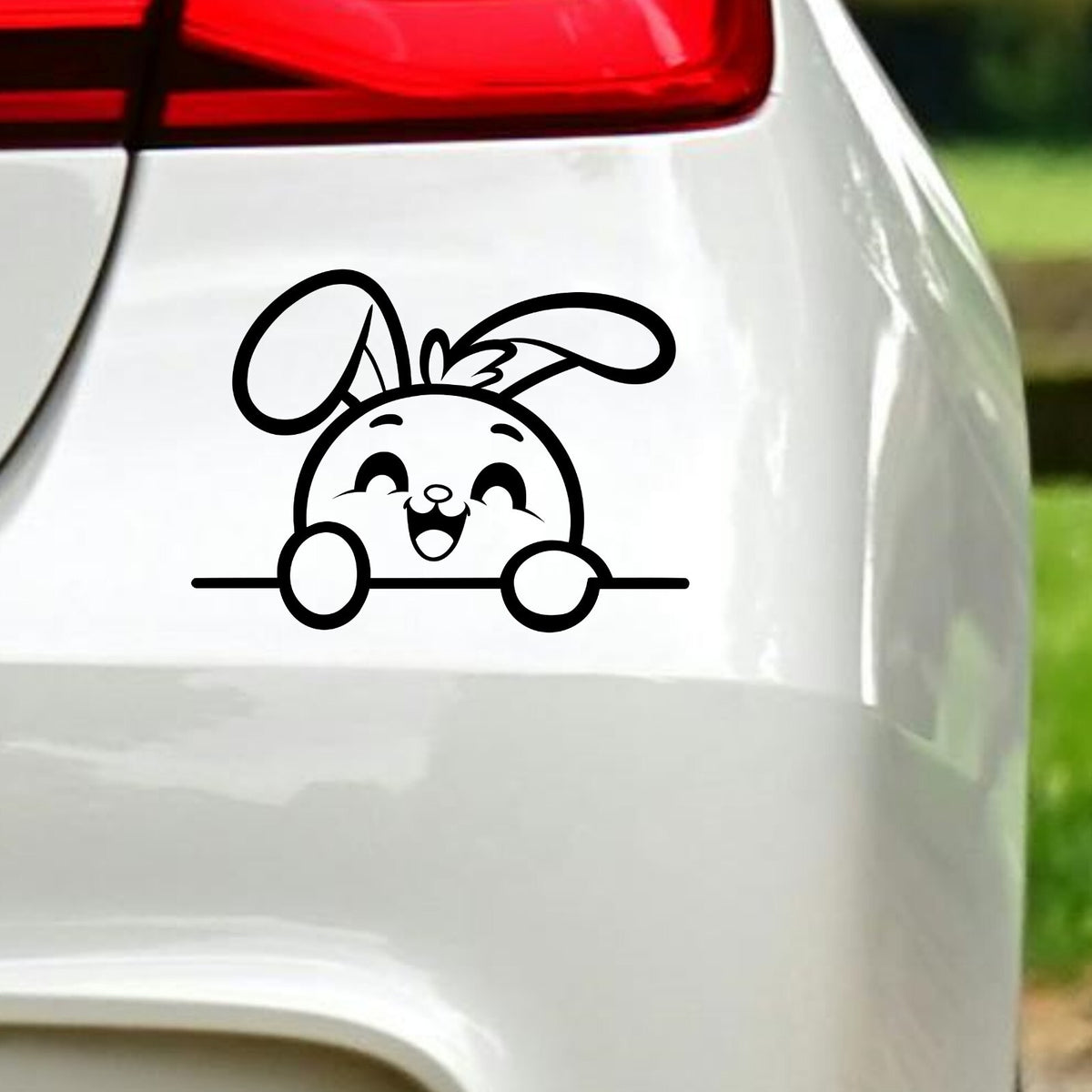 Happy Peeking Bunny vinyl sticker — black decal on white vehicle bodywork.