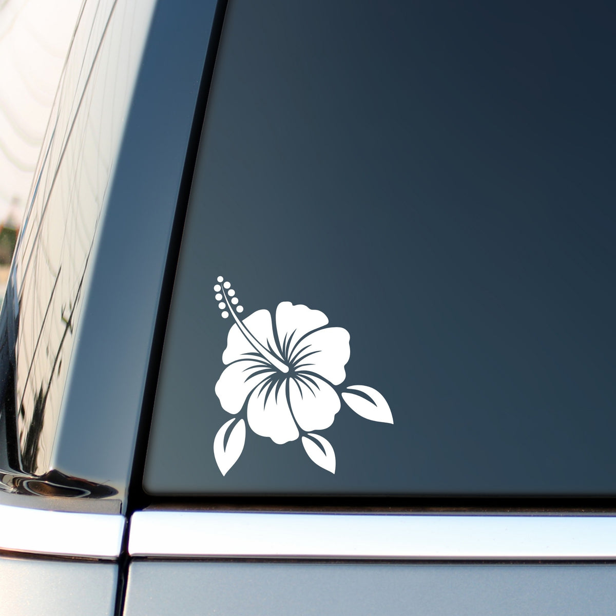 White Hibiscus Flower Car Sticker – Design 1 on a dark vehicle window.