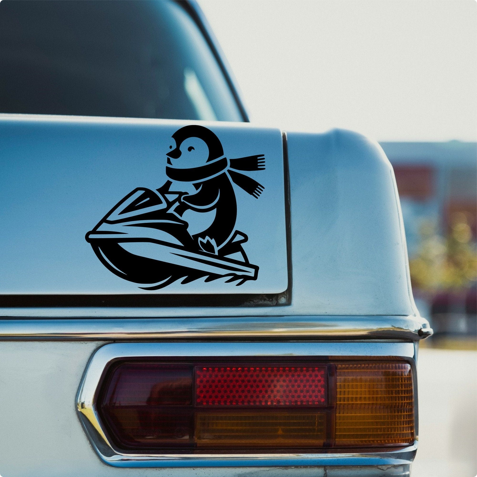 Penguin on a jet ski vinyl car sticker design 3 main product image