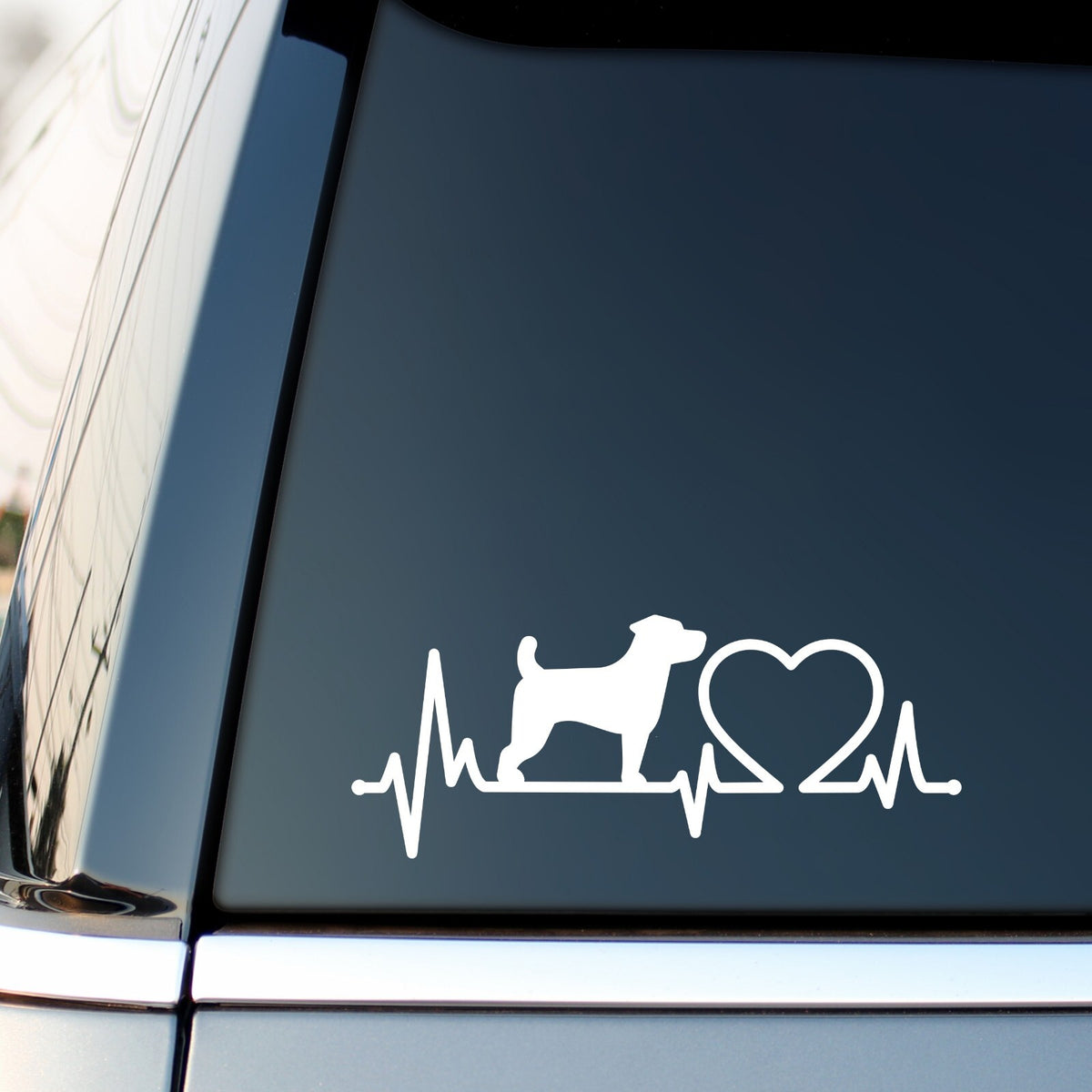 White jack russell heartbeat sticker on a vehicle side window.
