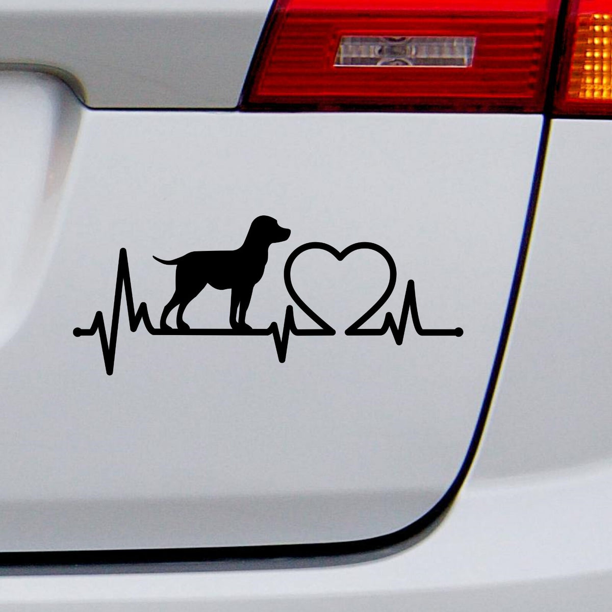 Black Labrador Heartbeat decal on a white car rear panel.