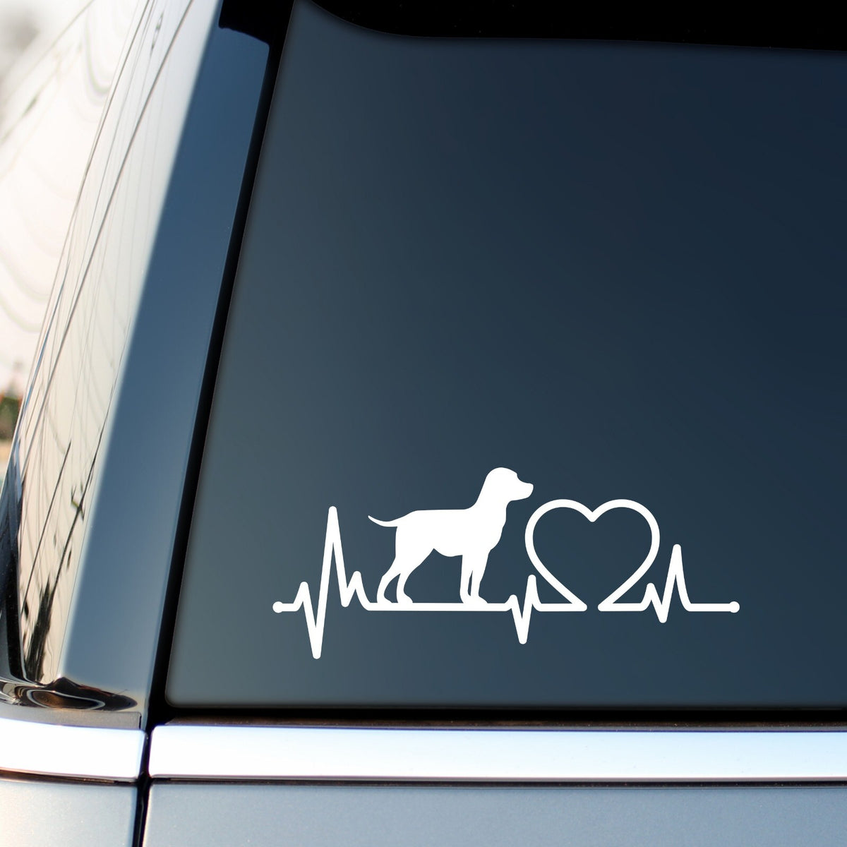 White Labrador Heartbeat decal on a car side window.