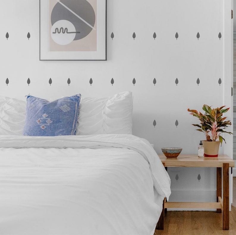Grey leaf wall stickers in a bedroom