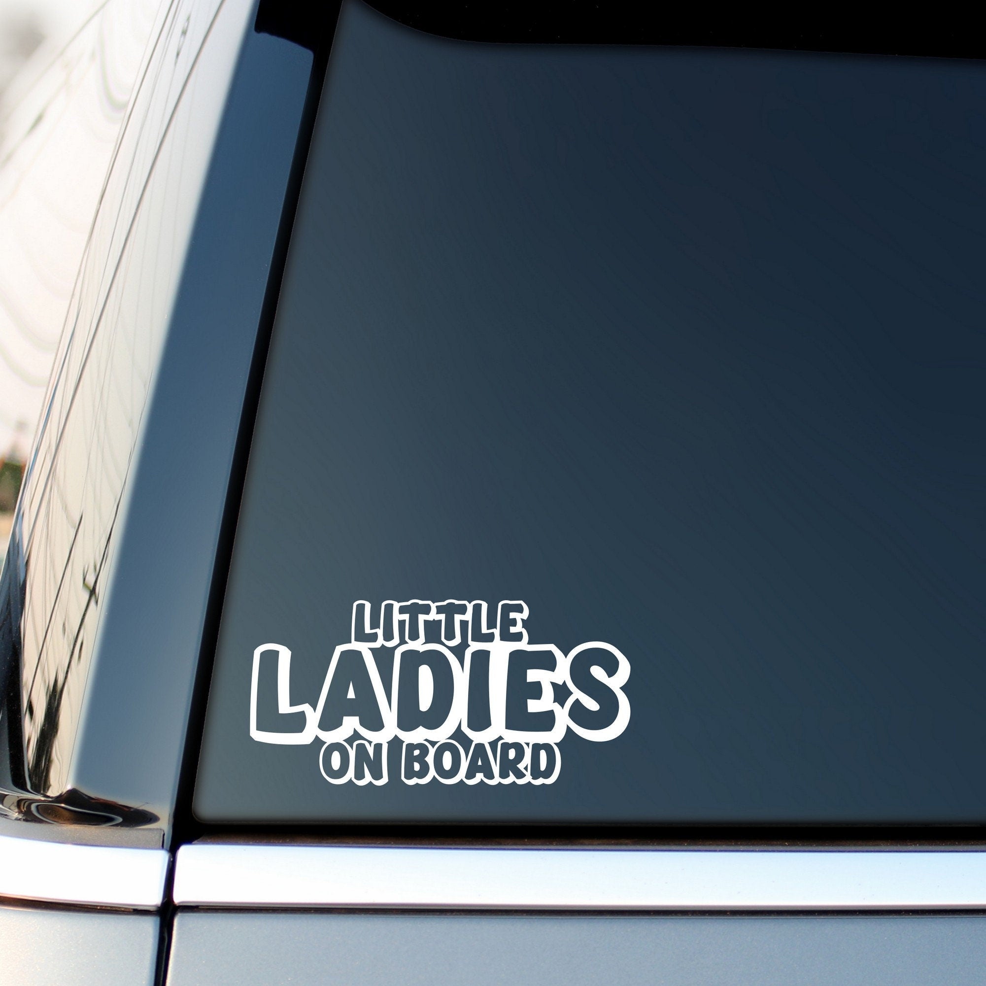 Little Ladies On Board outline car sticker shown on a vehicle rear window