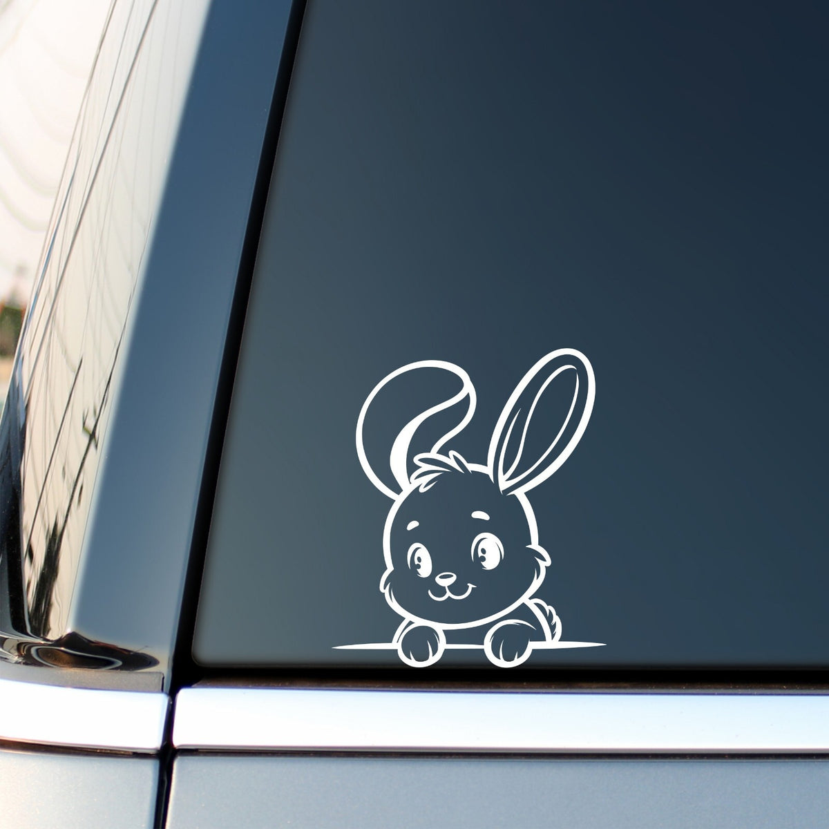 Peeking Bunny Bent Ear vinyl sticker — white decal on a vehicle window.