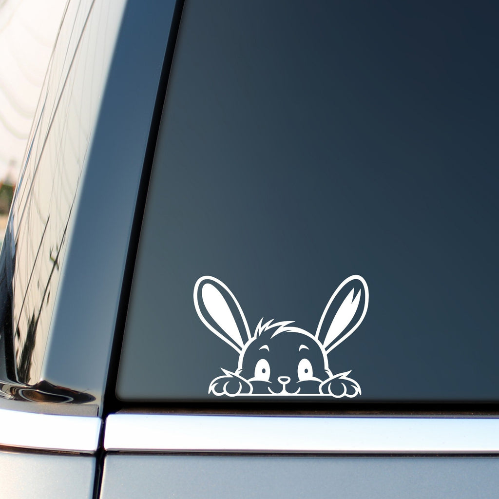 Peeking Bunny Face vinyl sticker — white decal on a vehicle window.