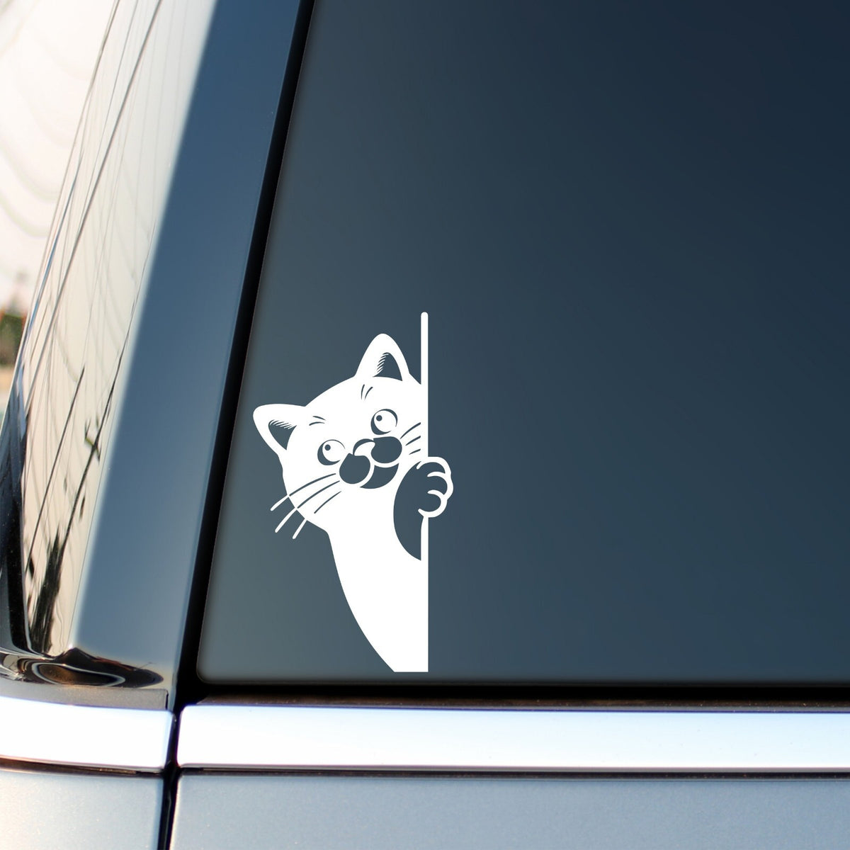 White Peeking Cat decal – Side View Design 1 on a car side window.
