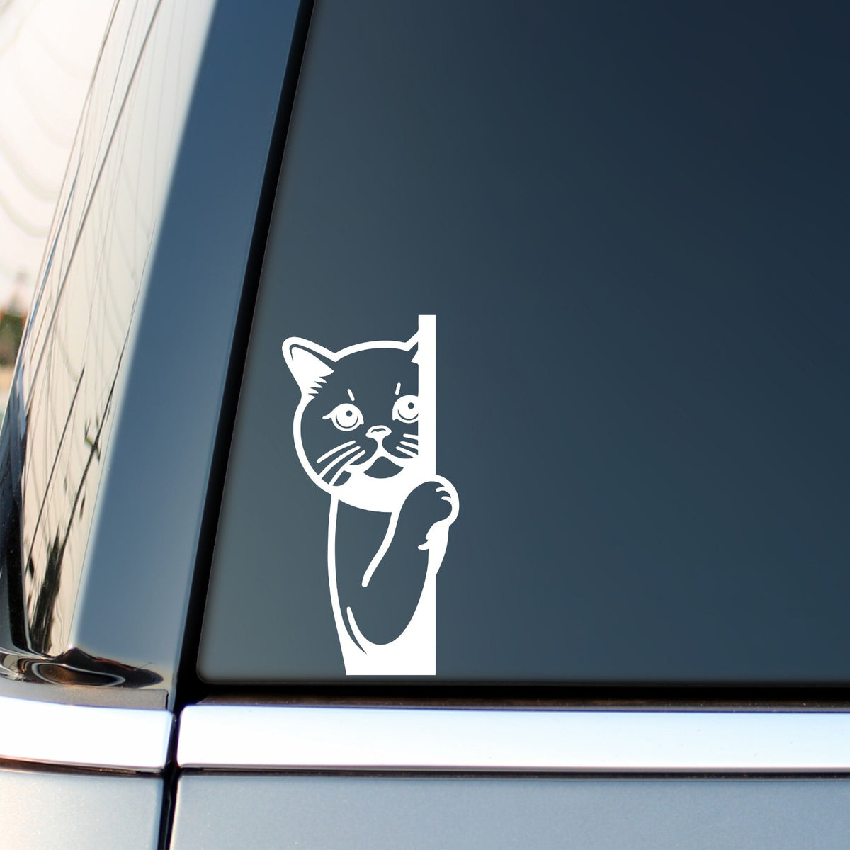 White Peeking Cat decal – Side View Design 2 on a car side window.