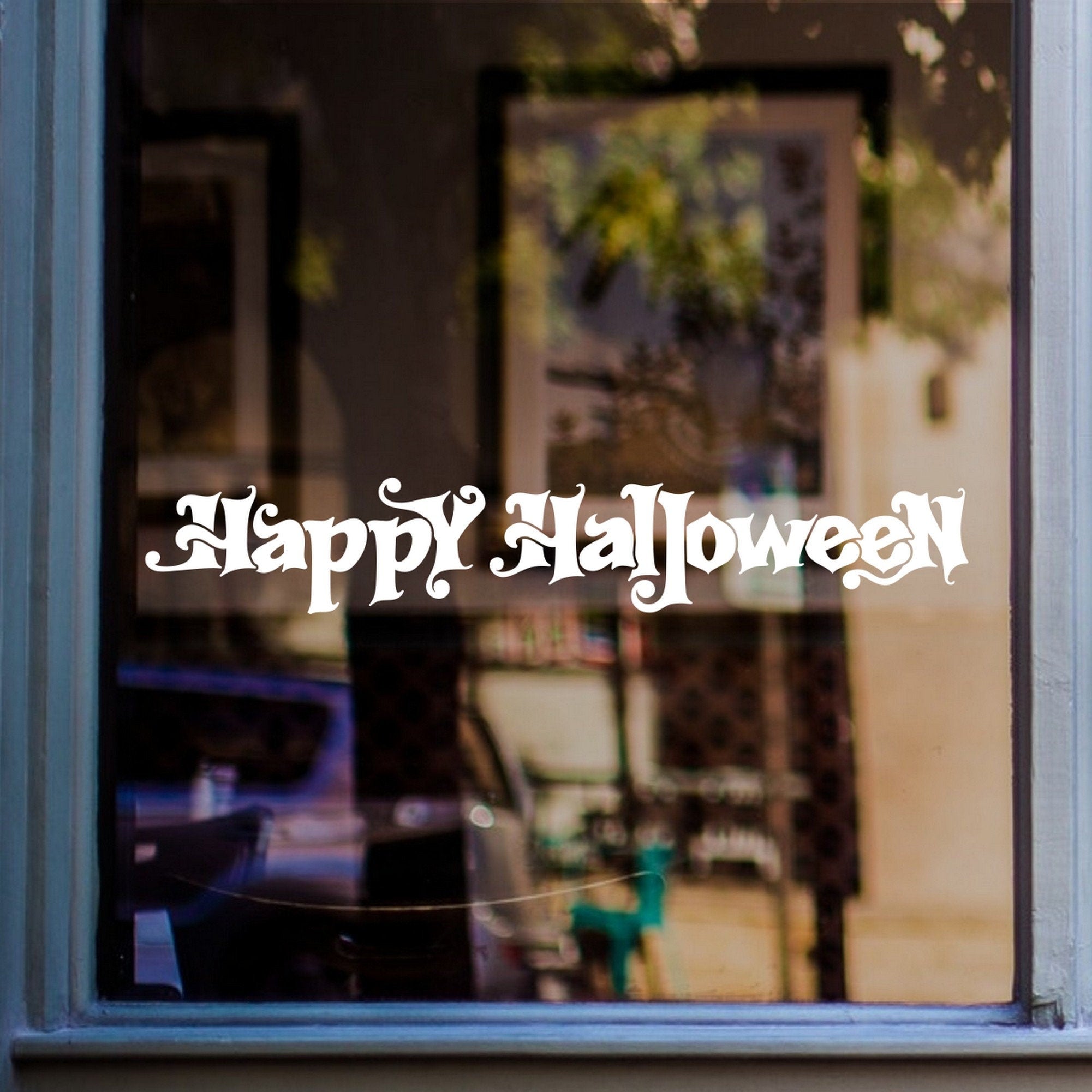 Happy Halloween Lettering Window Sticker displayed on a window