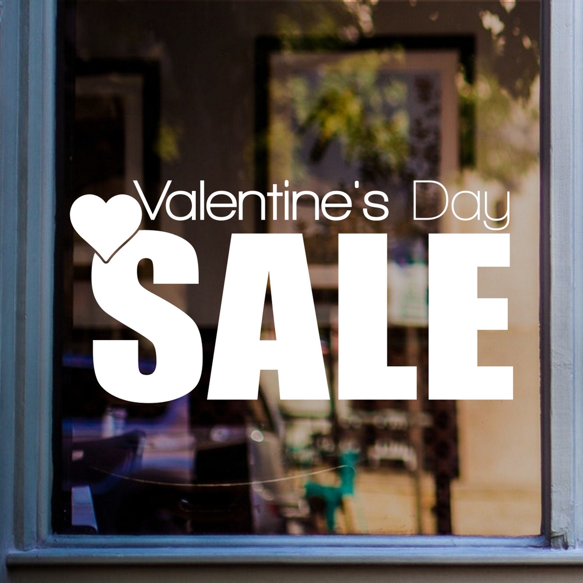 Valentine’s Day Sale Window Sticker shown on a shop window