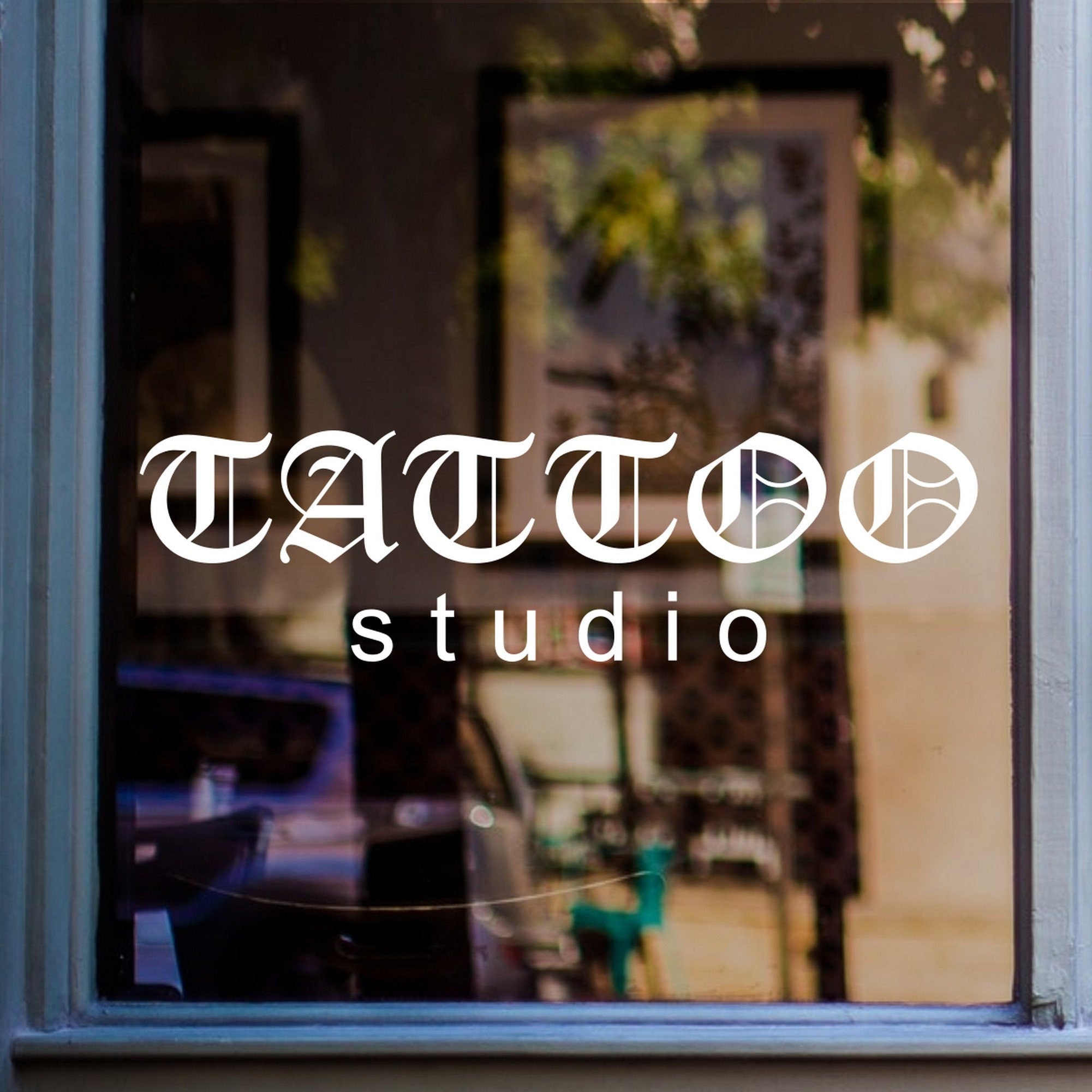 Tattoo Studio Shop Window Sticker displayed on a shop window