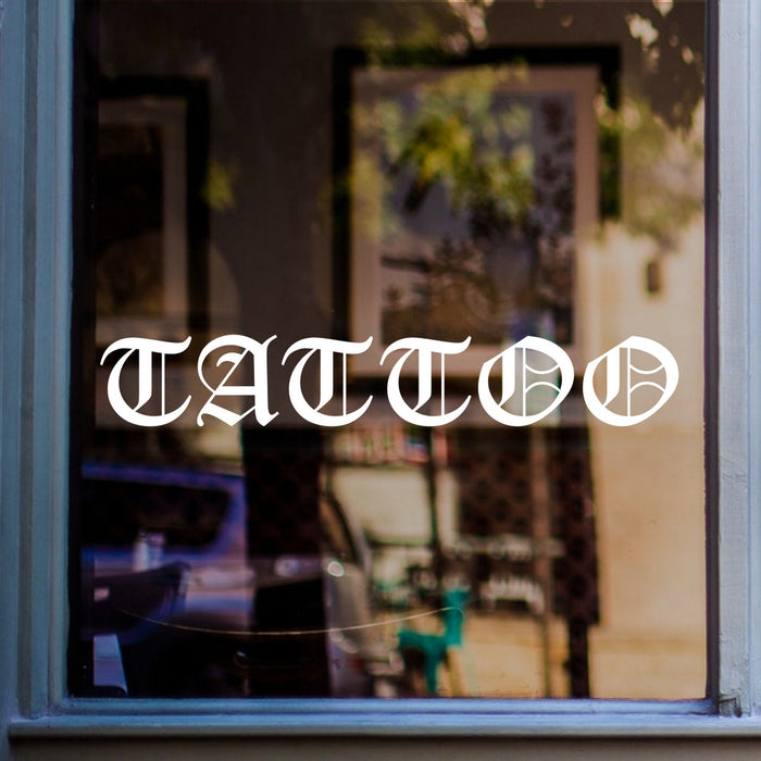 Tattoo Studio Window Sticker displayed on a window