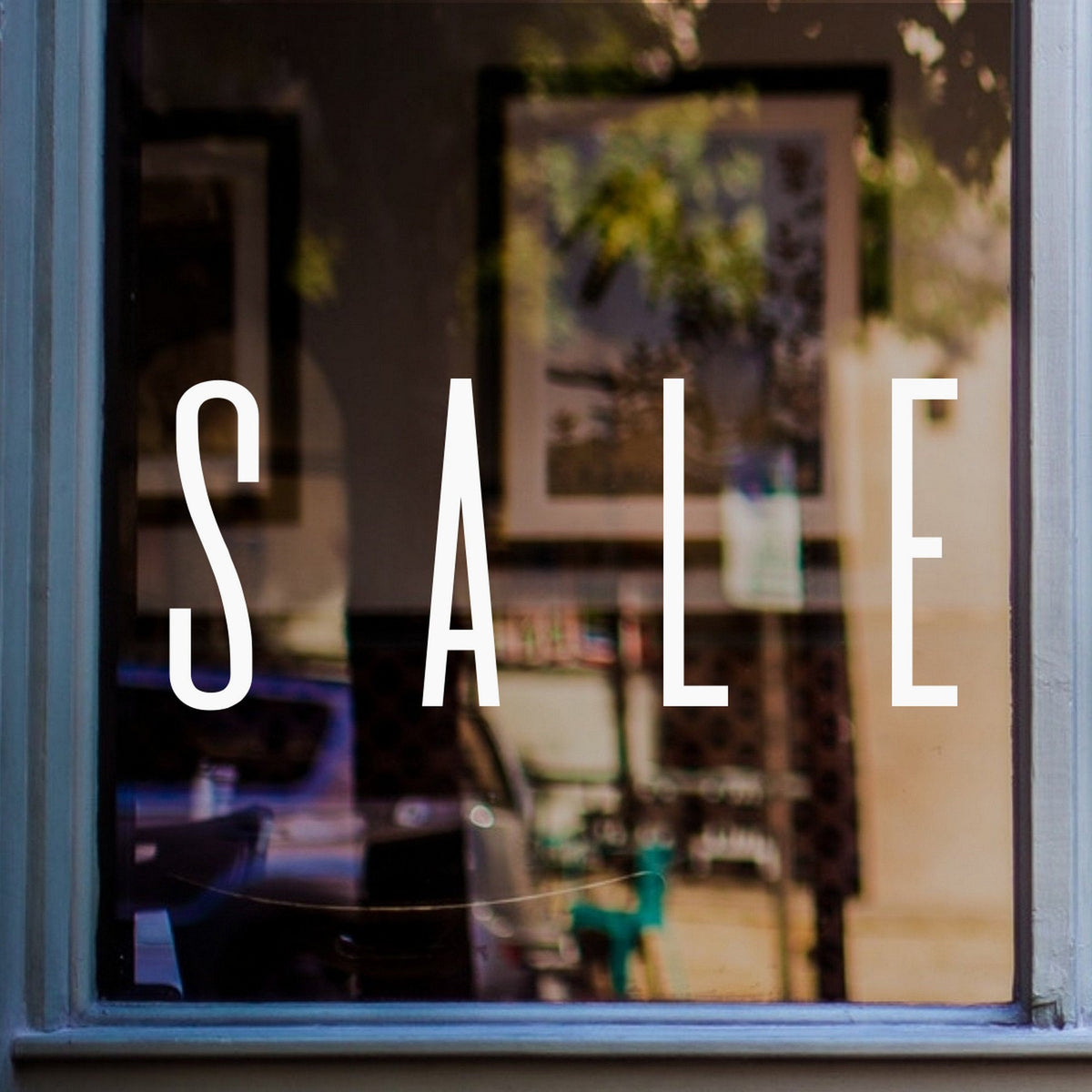 Sale Shop Window Sticker shown on a shop window