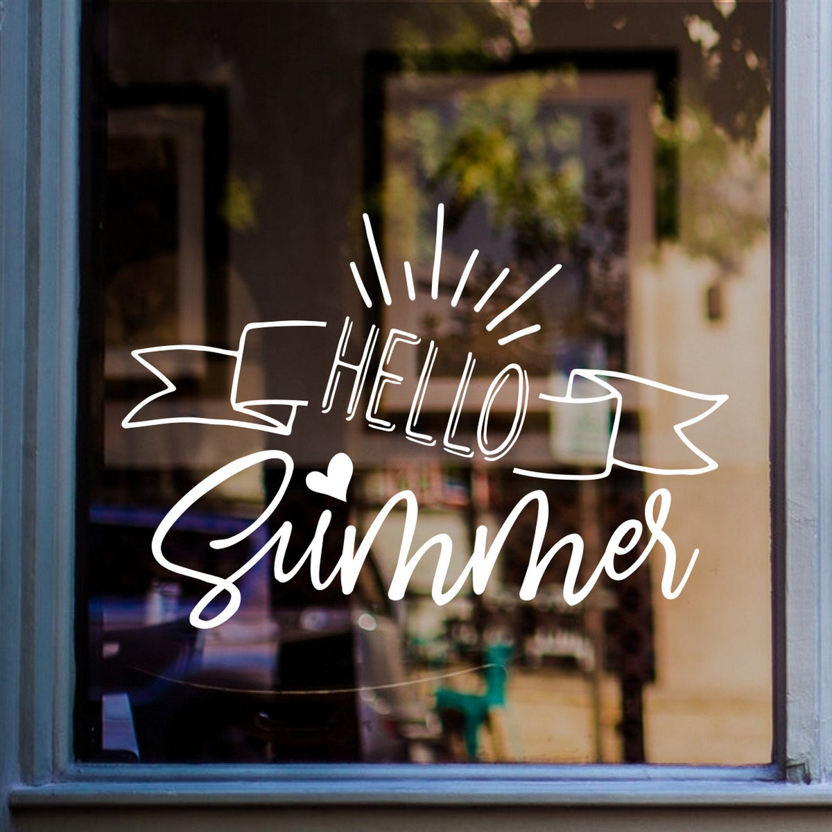 Hello Summer Window Sticker – Seasonal Display displayed on a shop window