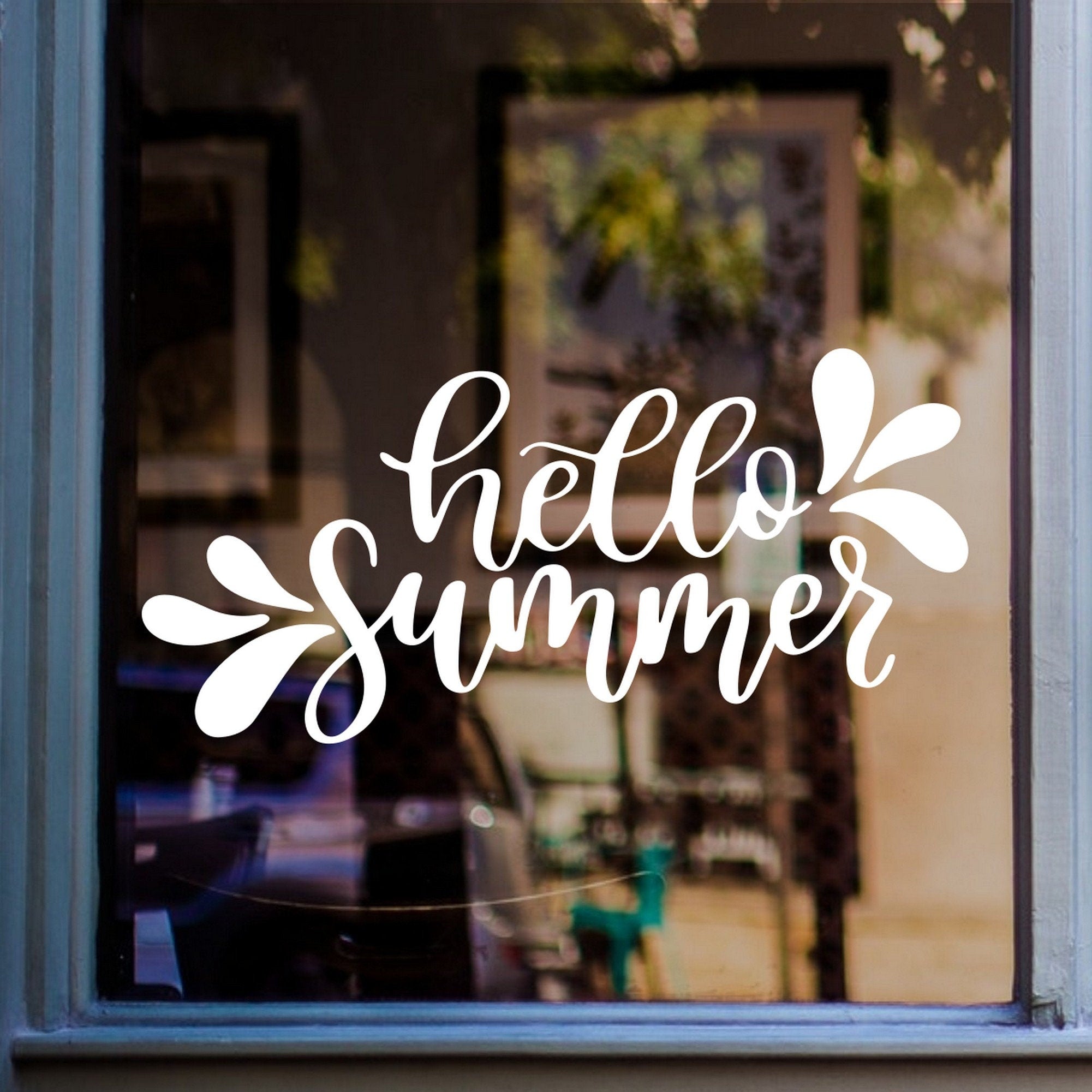 Hello Summer Shop Window Sticker displayed on a shop window
