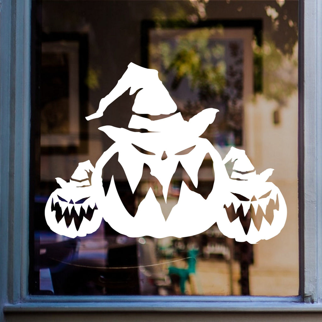 Halloween Pumpkin Window Sticker displayed on a window