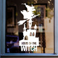 Home of the Witch Halloween Window Sticker shown on a shop window