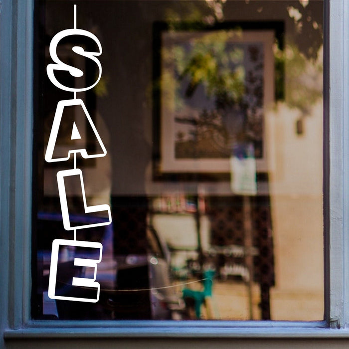 Vertical Sale Shop Window Sticker displayed on a shop window