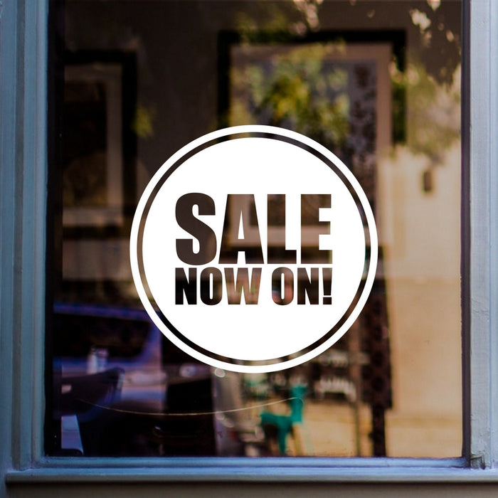 Sale Now On Window Sticker displayed on a window
