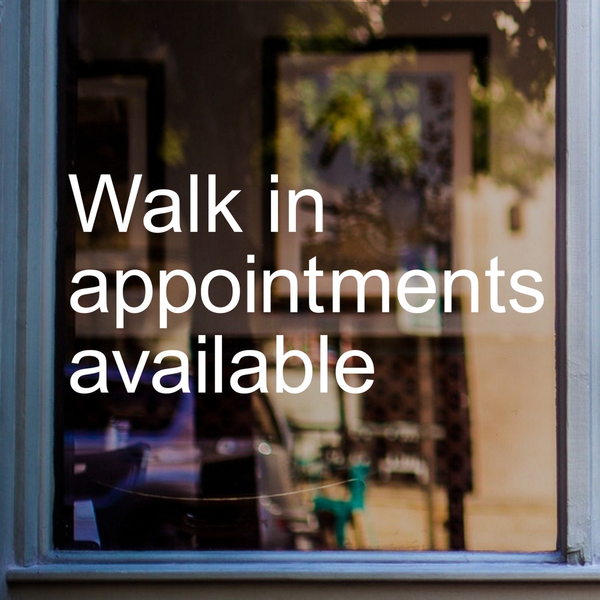 Walk-In Appointments Available Window Sticker displayed on a shop window