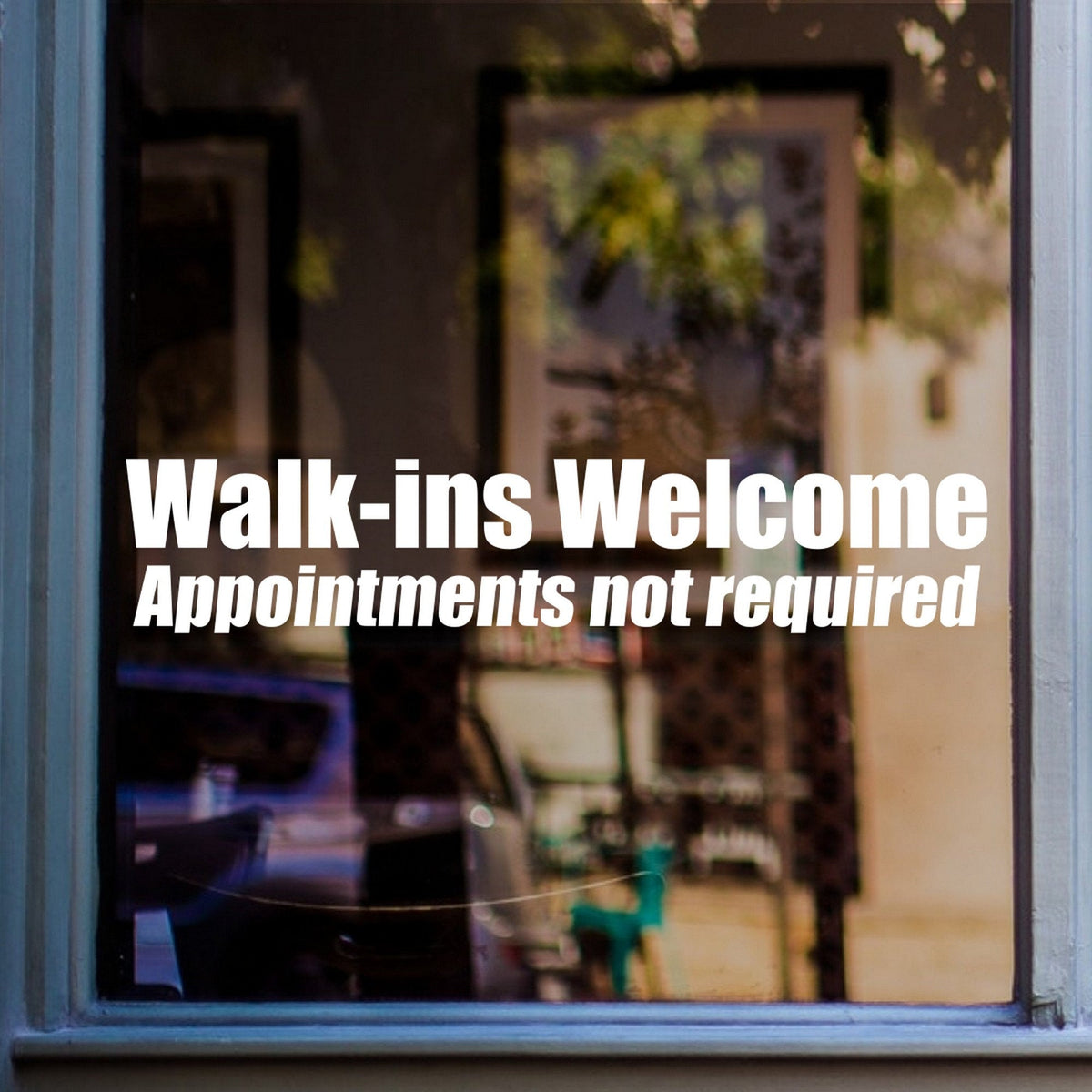 Walk-Ins Welcome Window Sticker shown on a shop window