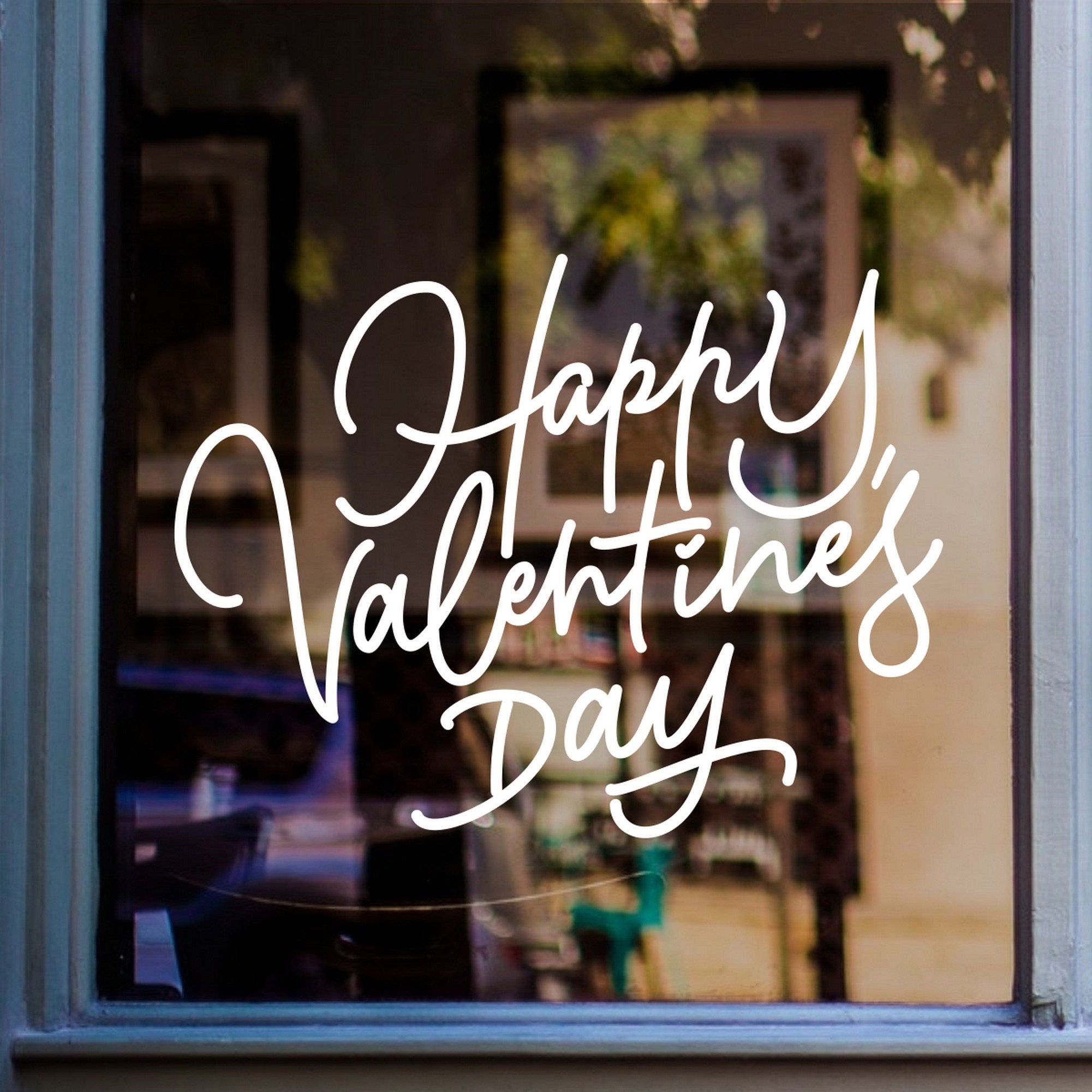 Happy Valentine’s Day Hearts Window Sticker shown on a shop window