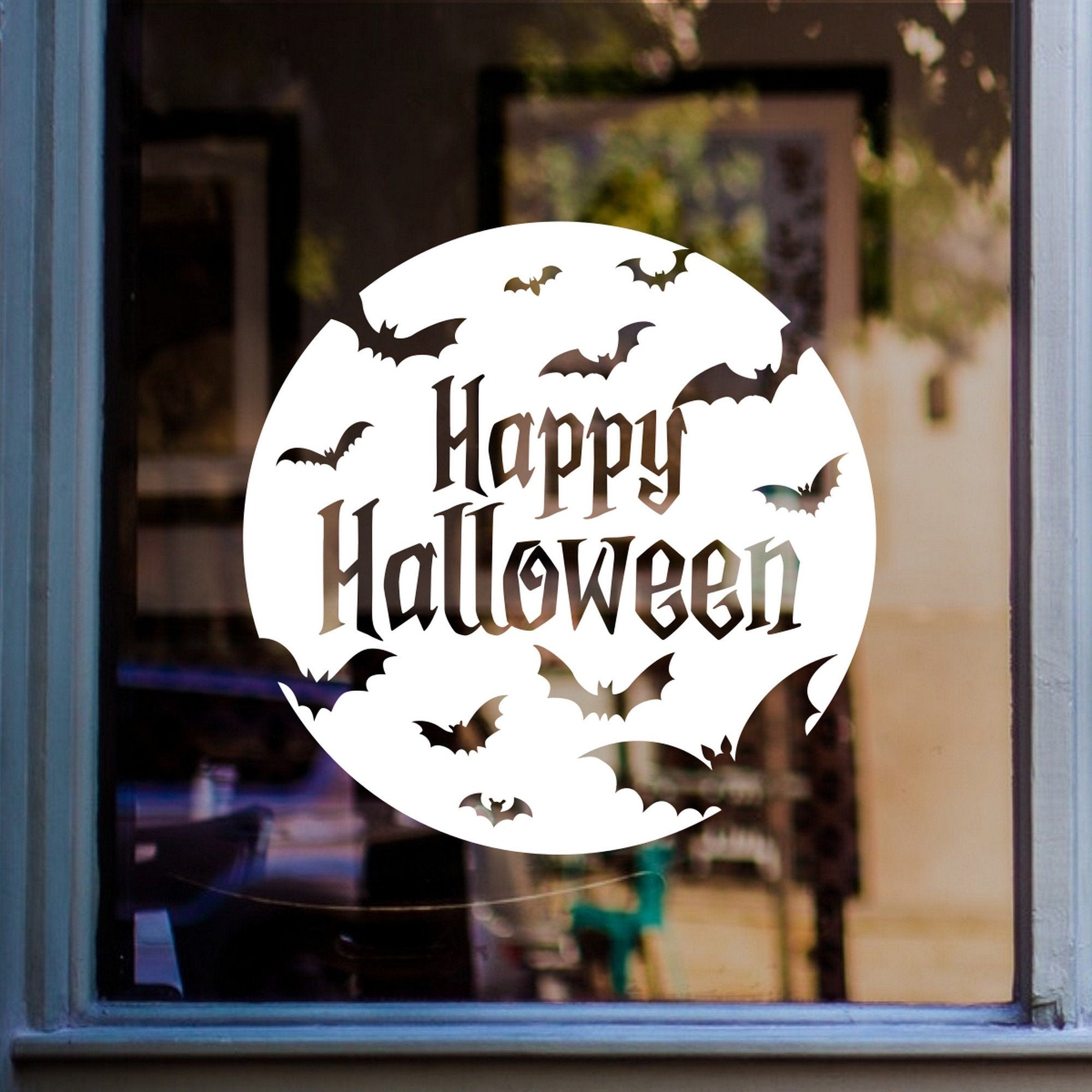 Happy Halloween Bats Window Sticker displayed on a window