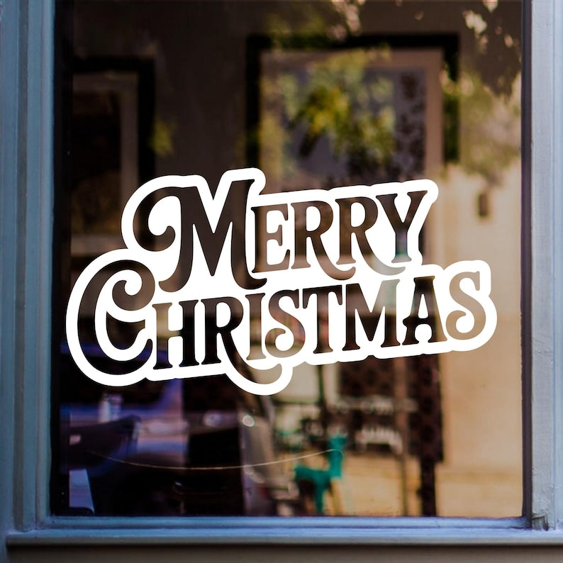 Bold Merry Christmas window sticker displayed in white vinyl on a home window.