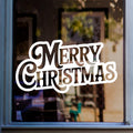 Bold Merry Christmas window sticker displayed in white vinyl on a home window.