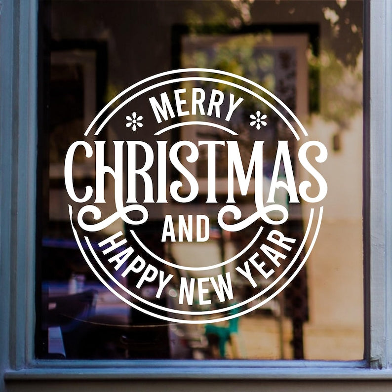 Merry Christmas window sticker with circular festive lettering displayed on shop glass.