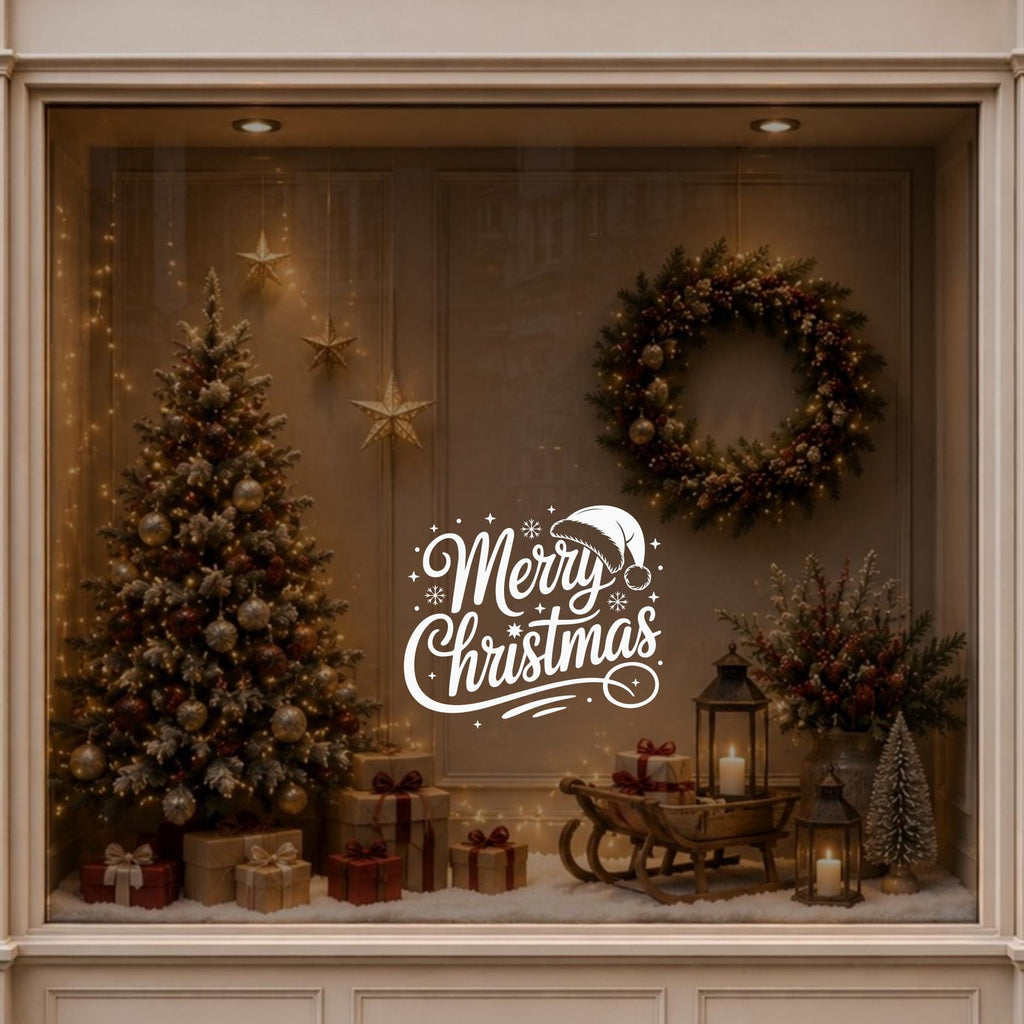 Merry Christmas window decal displayed on a warmly decorated festive shop window