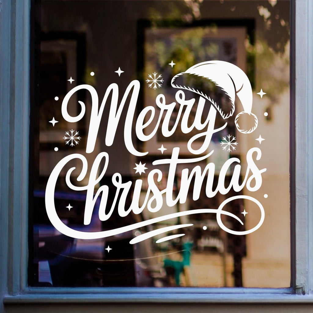 Merry Christmas window sticker with Santa hat and decorative lettering displayed in white vinyl on glass.