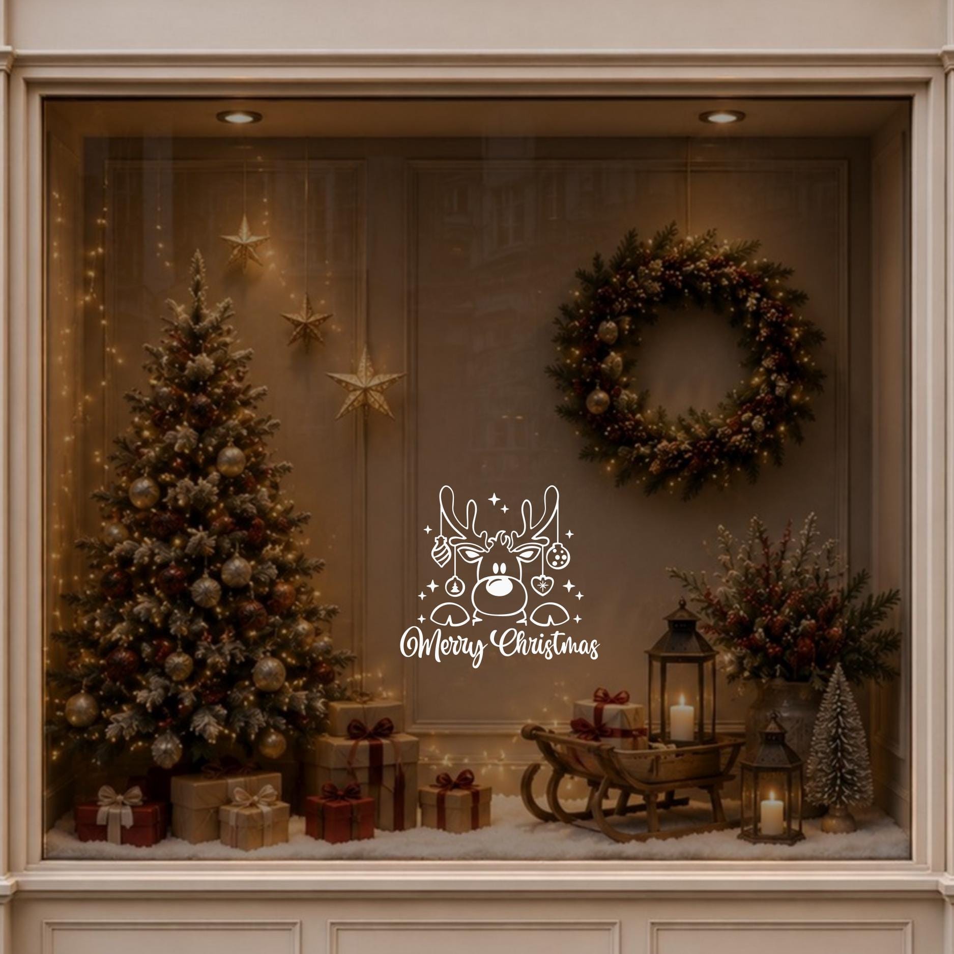 Reindeer Christmas window decal displayed on a warmly decorated festive shop window