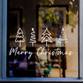 White Merry Christmas window sticker with four minimalist Christmas tree drawings displayed on a shop window