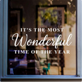 Most Wonderful Time of the Year Christmas window sticker displayed in white vinyl on a shop window