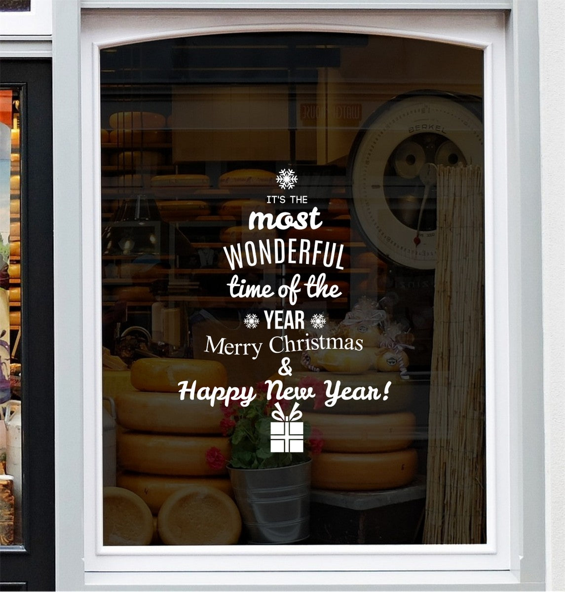 It's the Most Wonderful Time of the Year Christmas decal displayed on a festive shop window