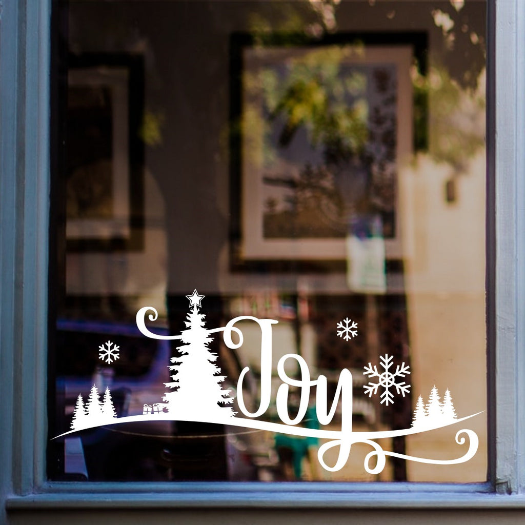 White Joy Christmas scene window sticker on a cheese shop window