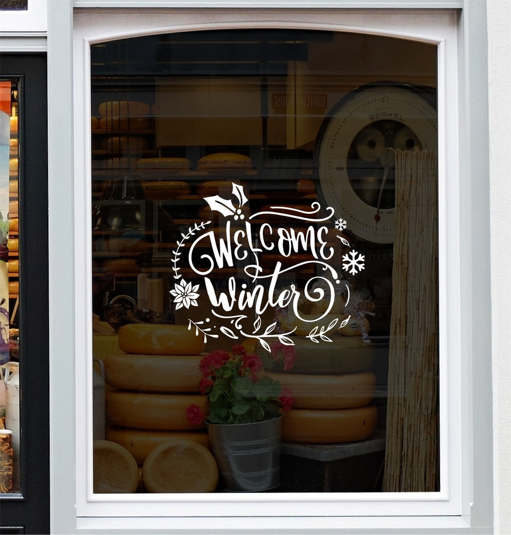 White Welcome Winter festive vinyl decal on a window